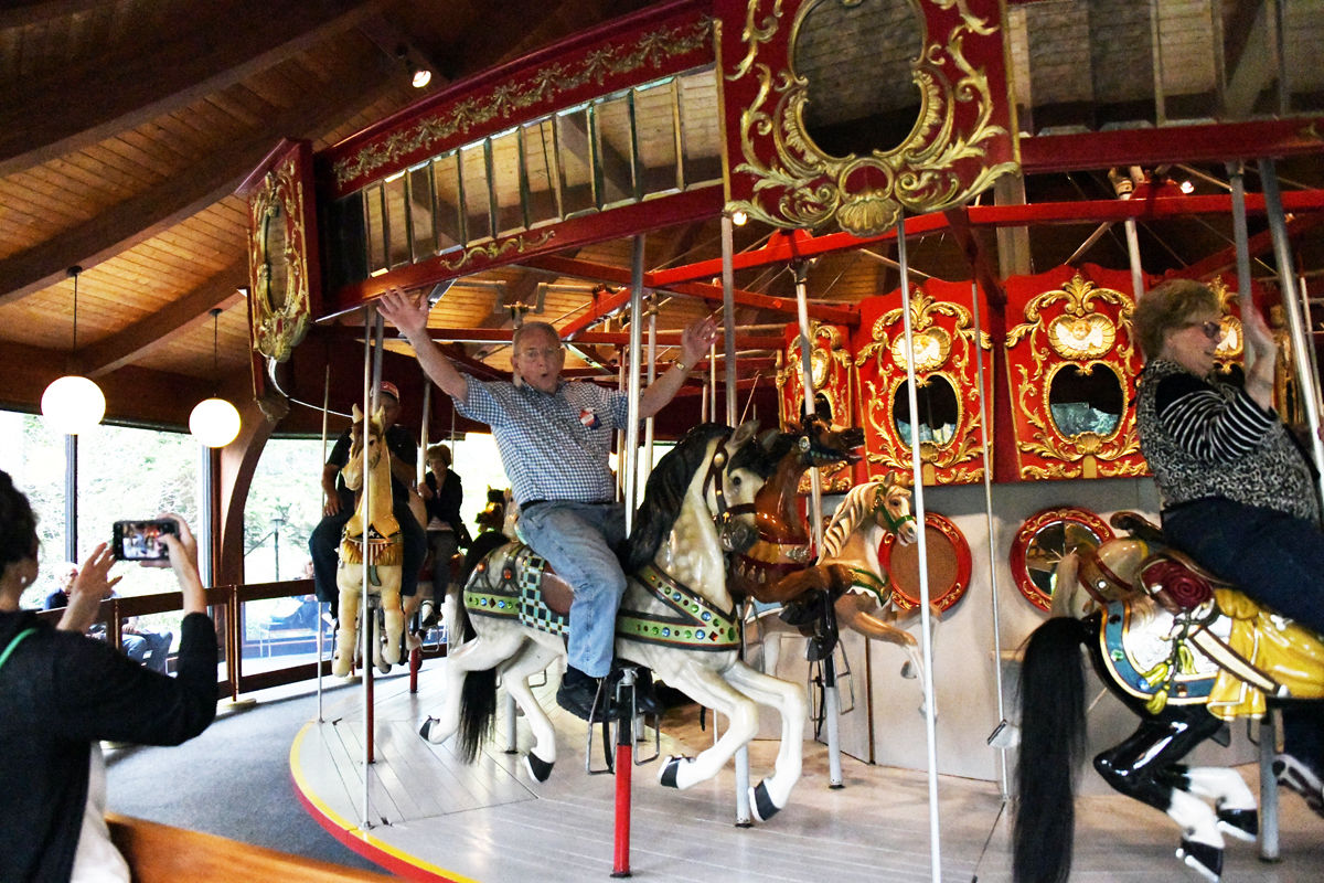 087 Clarence Hoffman says - Look, no hands - as he rides the carousel.jpg